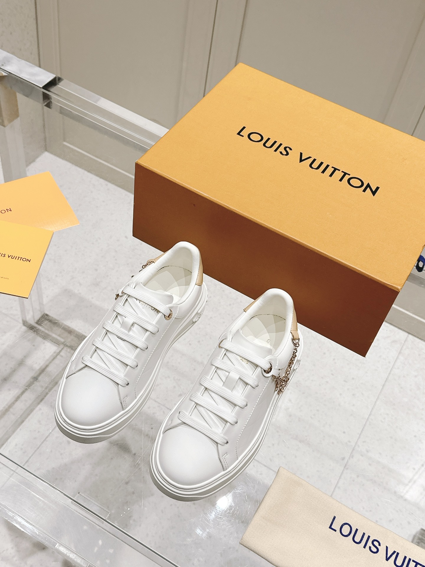 Louis Vuitton Women's White Leather Low-Top Sneakers with Charm Detail 3 i1728344964 5826 0