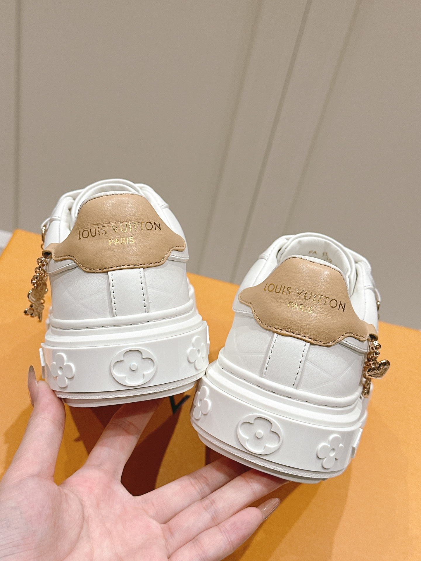 Louis Vuitton Women's White Leather Low-Top Sneakers with Charm Detail 9 i1728344964 7173 5