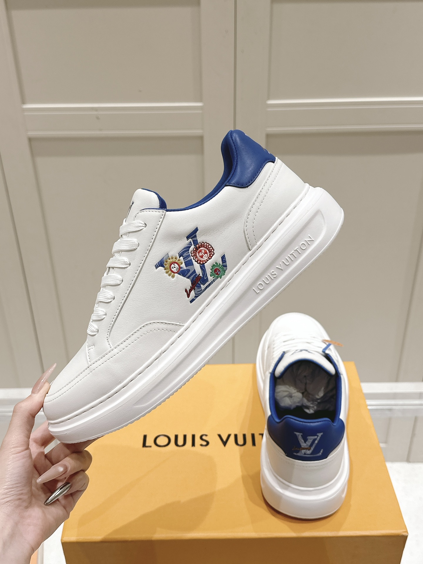 Louis Vuitton Men's White Leather Sneaker with Floral LV Logo