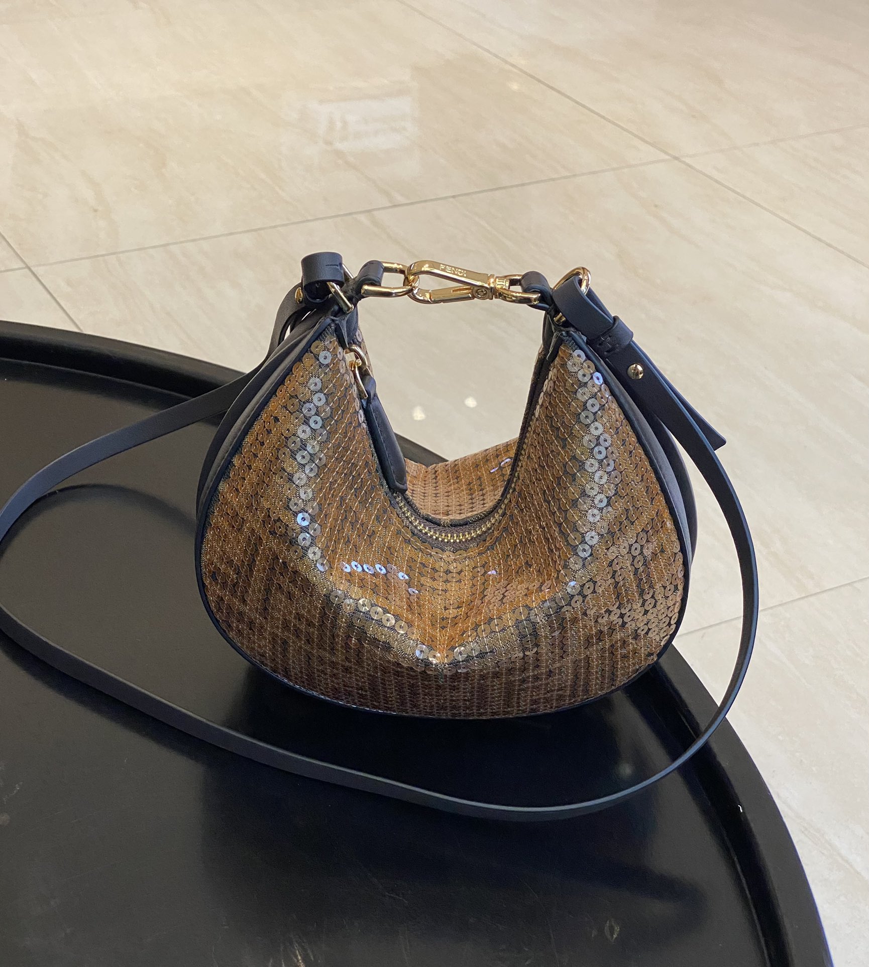 Fendi has actually released a classic wrist bag with its own embroidered sequin version, which can really add a sense of sophistication and elega