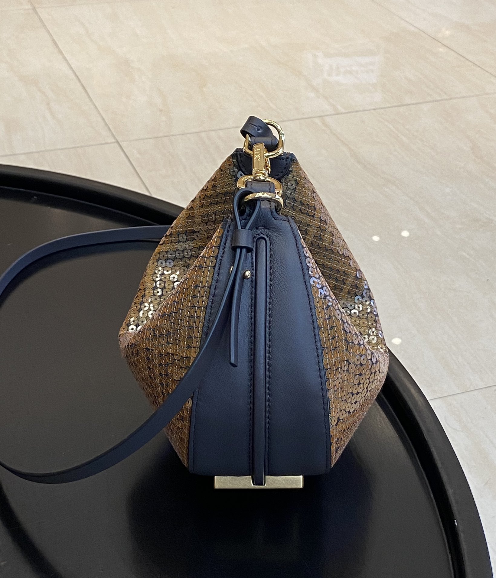 Fendi has actually released a classic wrist bag with its own embroidered sequin version, which can really add a sense of sophistication and elega
