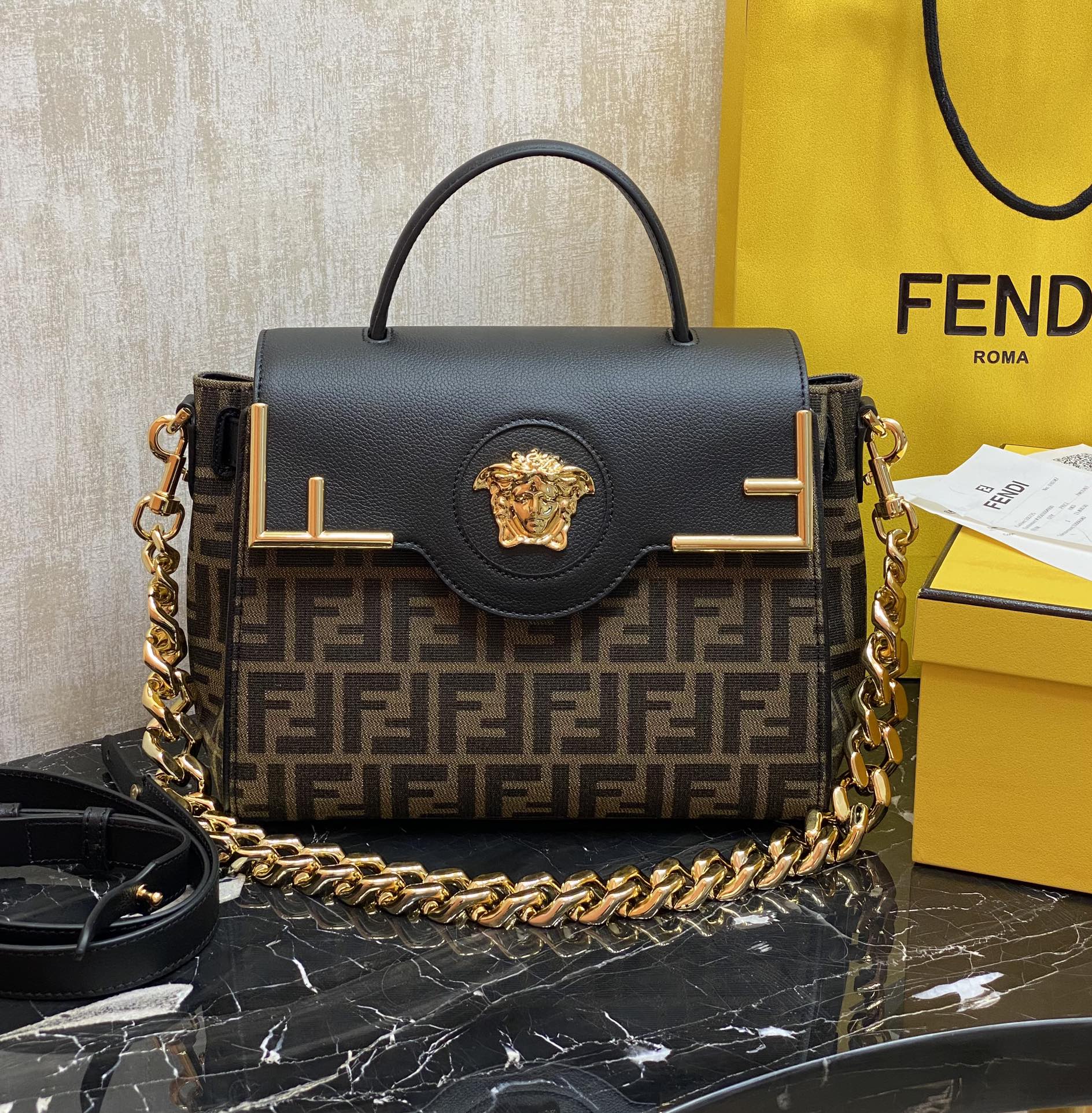 Fendi The most popular joint brand of the century, the versatile handbag can be carried by hand or worn cross-body using the interchangeable chai