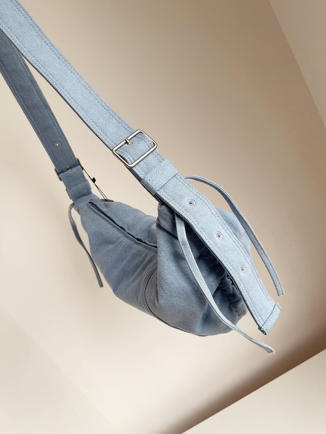 Crafted from durable denim, this spacious bag features dual side - Bag
