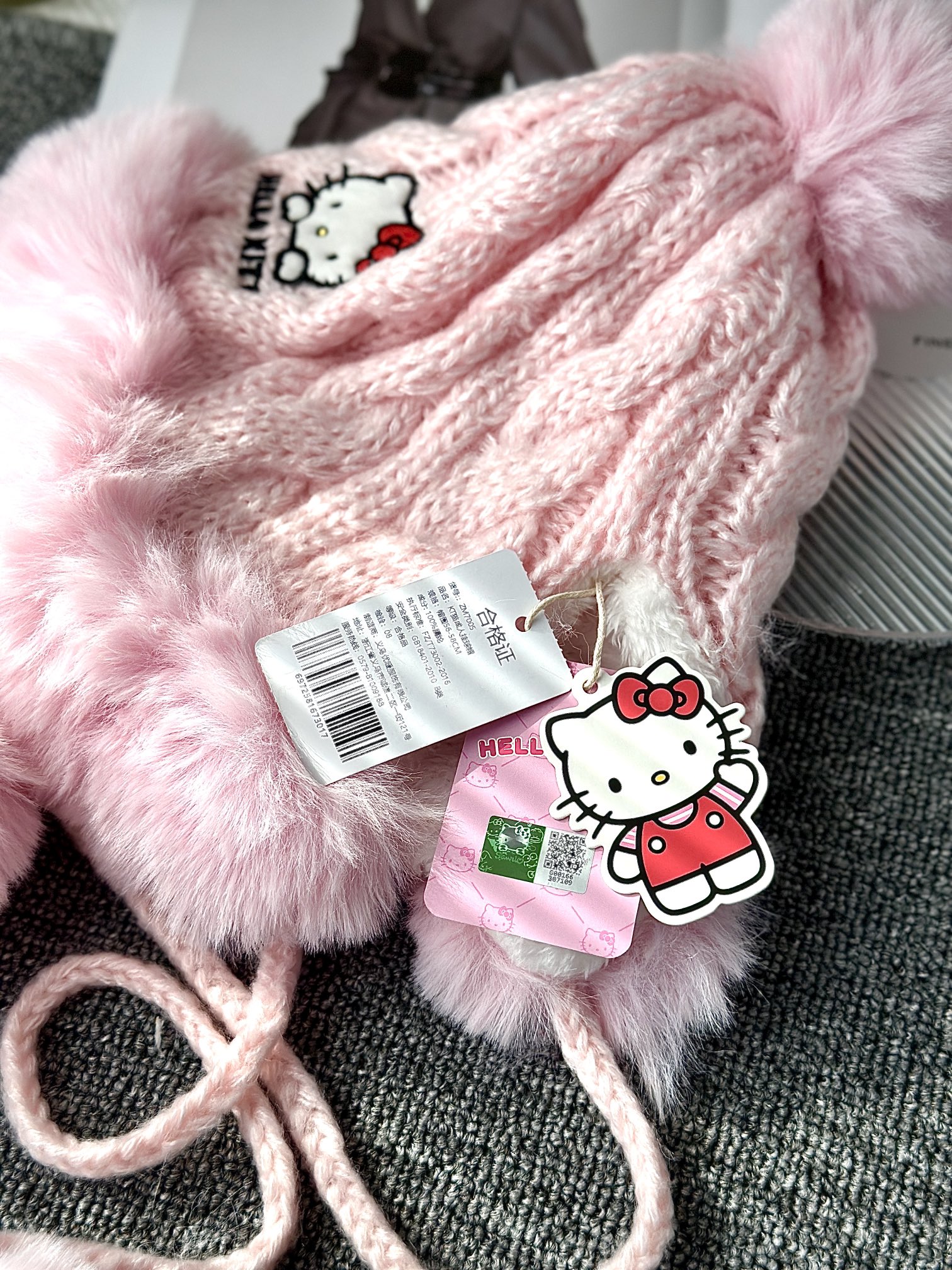 Hello Kitty Pink Pom-Pom Knit Beanie. Crafted from a soft, plush-texture - Comprehensive 7