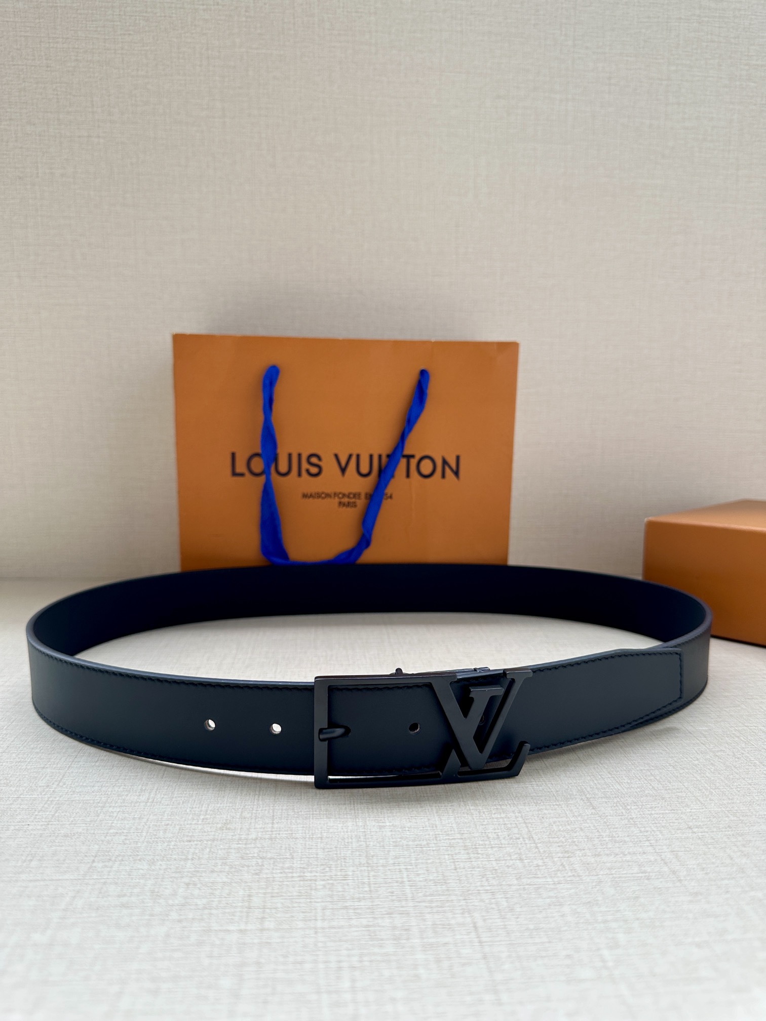 3.4 wide LV Skyline belt dyed in classic tones on fine lambskin, cleverly integrating LV letters into the pin buckle, e…