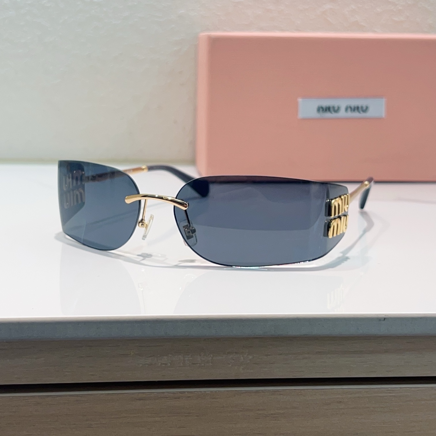 MIUMIU Miu Miu Rimless Metal Sunglasses