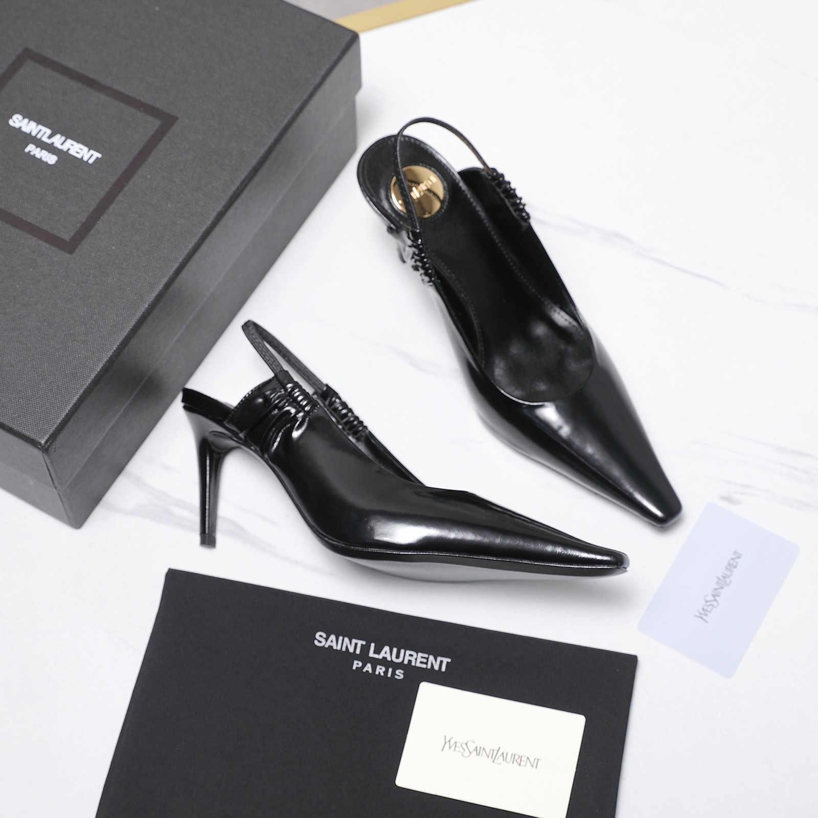 NO:787183,Top quality (with high-end airplane box) Saint Laurent fw26 new arrival～ YSL 26s spring and summer new small pointed toe flat back sandals  Ysl selects fine leather and tans it through multiple processes, giving it a smooth touch like silk satin. The heel drawstring is hand-wrinkled, and every texture is full of ingenuity, which not only ensures the fit, but also injects a touch of agility into the neat pointed toe. The gold roundel embellishes the footbed, showing refinement in a low-key manner, and every detail tells a sense of high-end.  The heel drawstring is an ingenious idea of modern design, breaking the stereotype of traditional empty shoes and finding a perfect balance between comfort and fashion. This pair of shoes is not only a single item, but also an expression of an attitude towards life. Upper cowhide, lining sheepskin, sole Italian genuine leather outsole, high flat heel/7.5cm, size 35-39 (40.41 custom-made, non-refundable) Price, high heels, saint laurent, saint  laurent,saint laurent,sandals,high heels,cowhide,sheepskin,Leather soles19860909顶级品质（配高档飞机盒） Saint Laurent 圣罗兰fw26 new arrival～ YSL 26s 春夏新款小尖头平底后空凉鞋 Ysl甄选细腻皮革,经多道工序鞣制,呈现出如丝缎般的柔滑触感.后跟抽绳采用手工褶皱工艺,每一道纹理都饱含匠心,既保证了贴合度,又为利落的尖头注入一丝灵动.金色圆标点缀鞋床,低调中透着精致,每一处细节都在诉说着高级感. 后跟抽绳则是现代设计的巧思,打破了传统后空鞋的刻板印象,在舒适与时髦之间找到了完美平衡.这双鞋,不仅是一件单品,更是一种生活态度的表达. 鞋面牛皮 内里垫脚羊皮 鞋底意大利真皮大底 跟高平底/7.5cm 码数35-39（40.41定做不退换） 价格,高跟鞋,saint laurent,saint laurent,saint laurent,sandals,high heels,cowhide,sheepskin,Leather soles,Women's Shoes