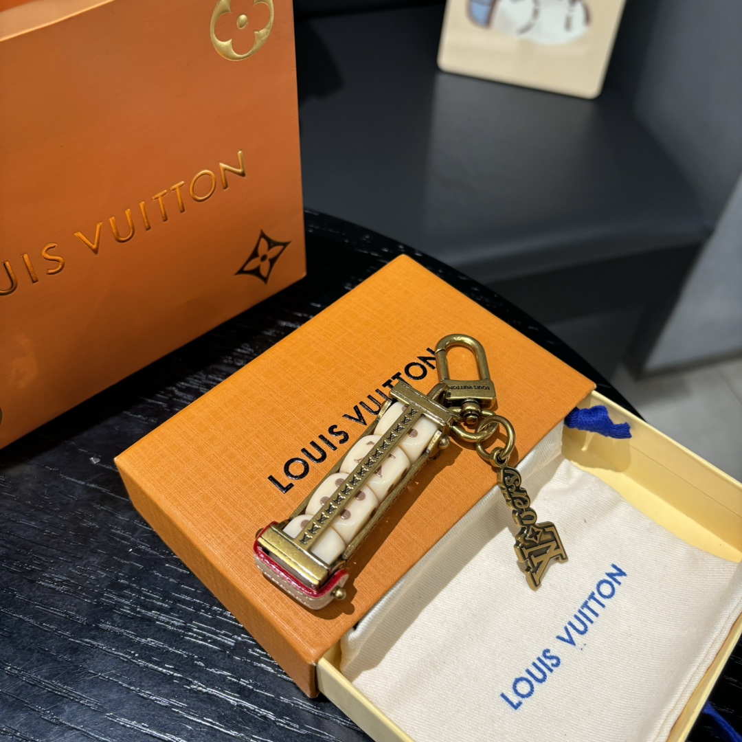 Side view of the leather keychain with Lovers dice