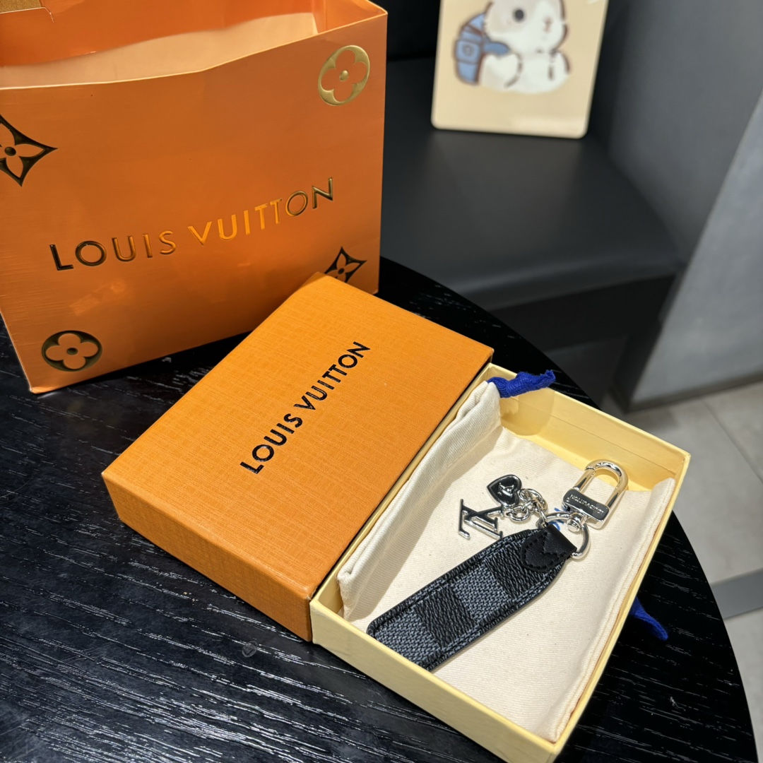 Louis Vuitton Black Grid Keychain in Hand