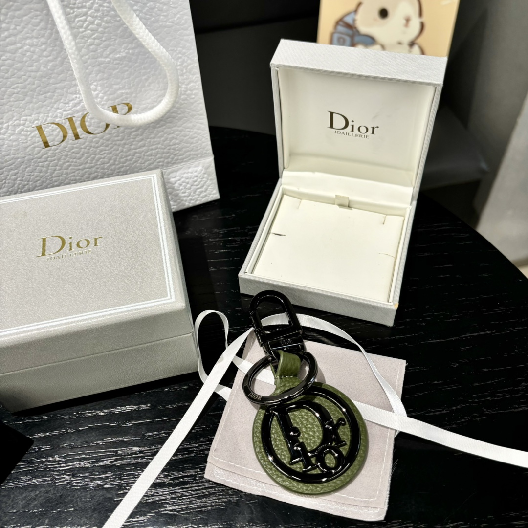 Luxurious CD Diamond Logo Key Button with Leather and Metal Details.