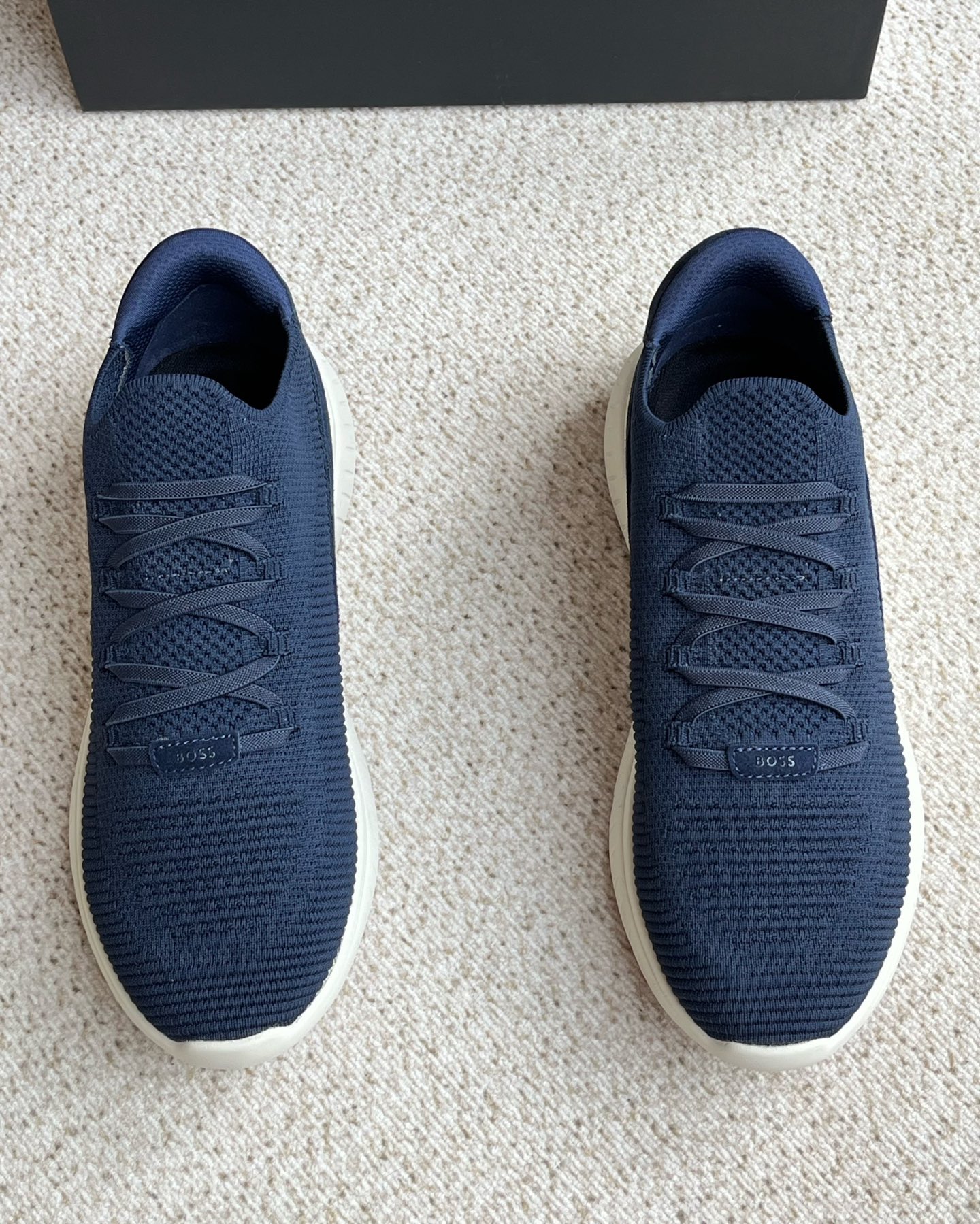 NO:356739,BOSS Men's Knitted Upper Sneakers This fashionable sneaker is made of knitted upper, with suede cowhide and calfskin decoration on the heel, and is decorated with three-color rubber exclusive logo details. The upper is individually knitted upper treatment to enhance the overall style. The foot cover is designed with elastic laces, with light EVA ribs and rubber soles. The upper foot is light and comfortable and breathable. The outer side is decorated with 