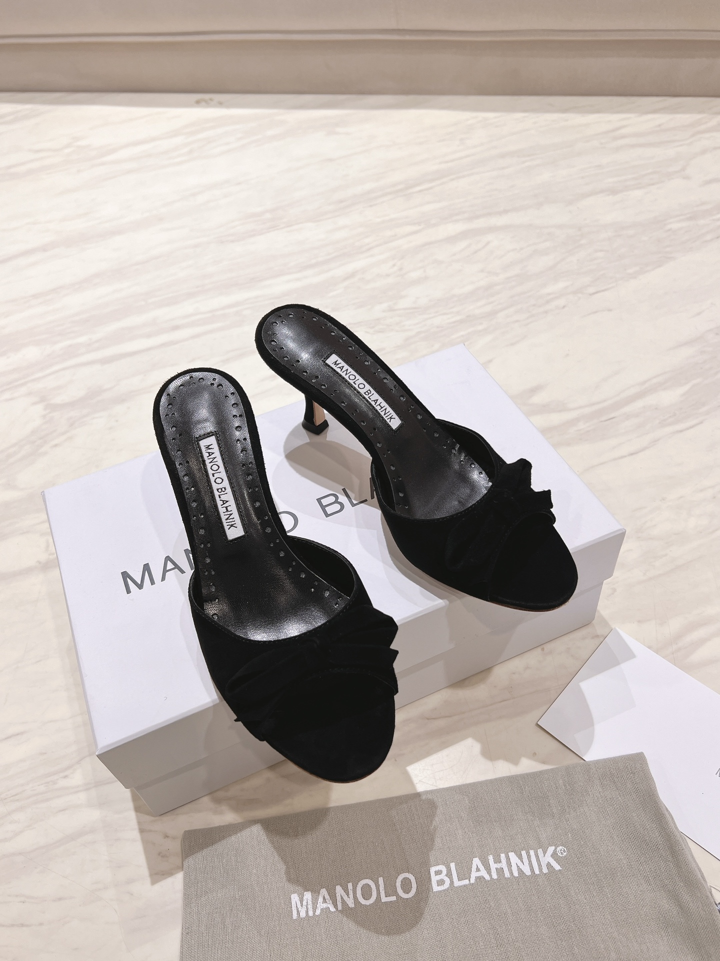 Manolo Blahnik Black Suede Mules with Bow Detail - 7.5cm Heel Height 1 Manolo Blahnik Black Suede Mules with Bow Detail - 7.5cm Heel Height