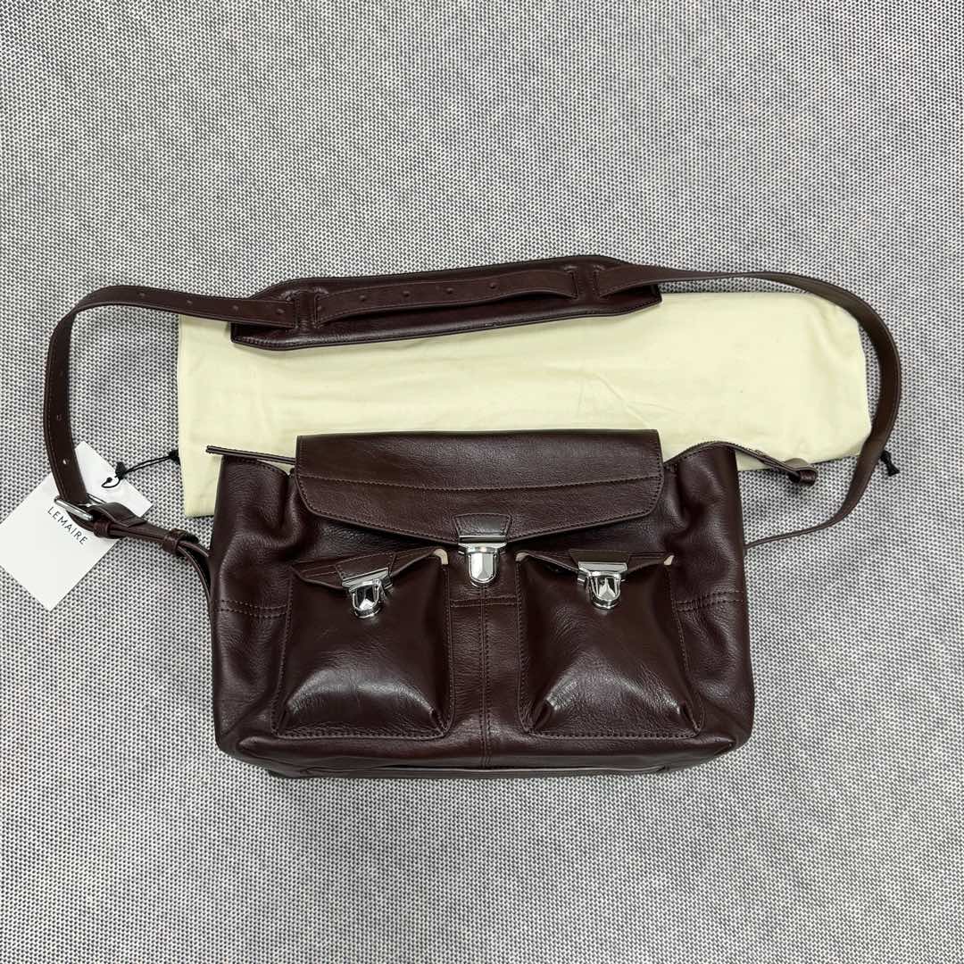 The Lemaire GEAR tool bag is made of imported wrinkled waxed cowhide with suede lining, retro zinc alloy hardware, and a multi-pocket design that