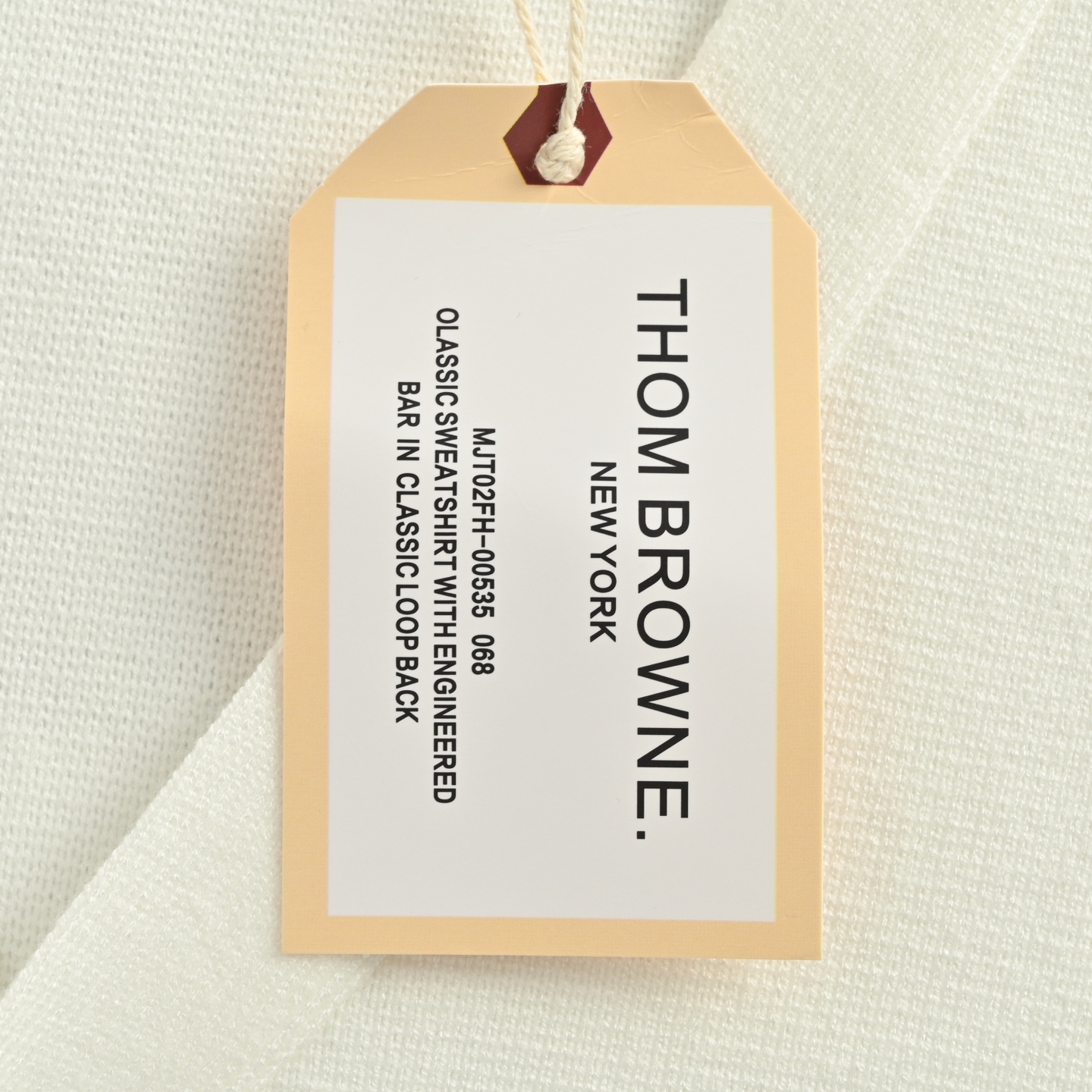 Thom Browne/汤姆布朗 25Fw 前短后长毛衣开衫
