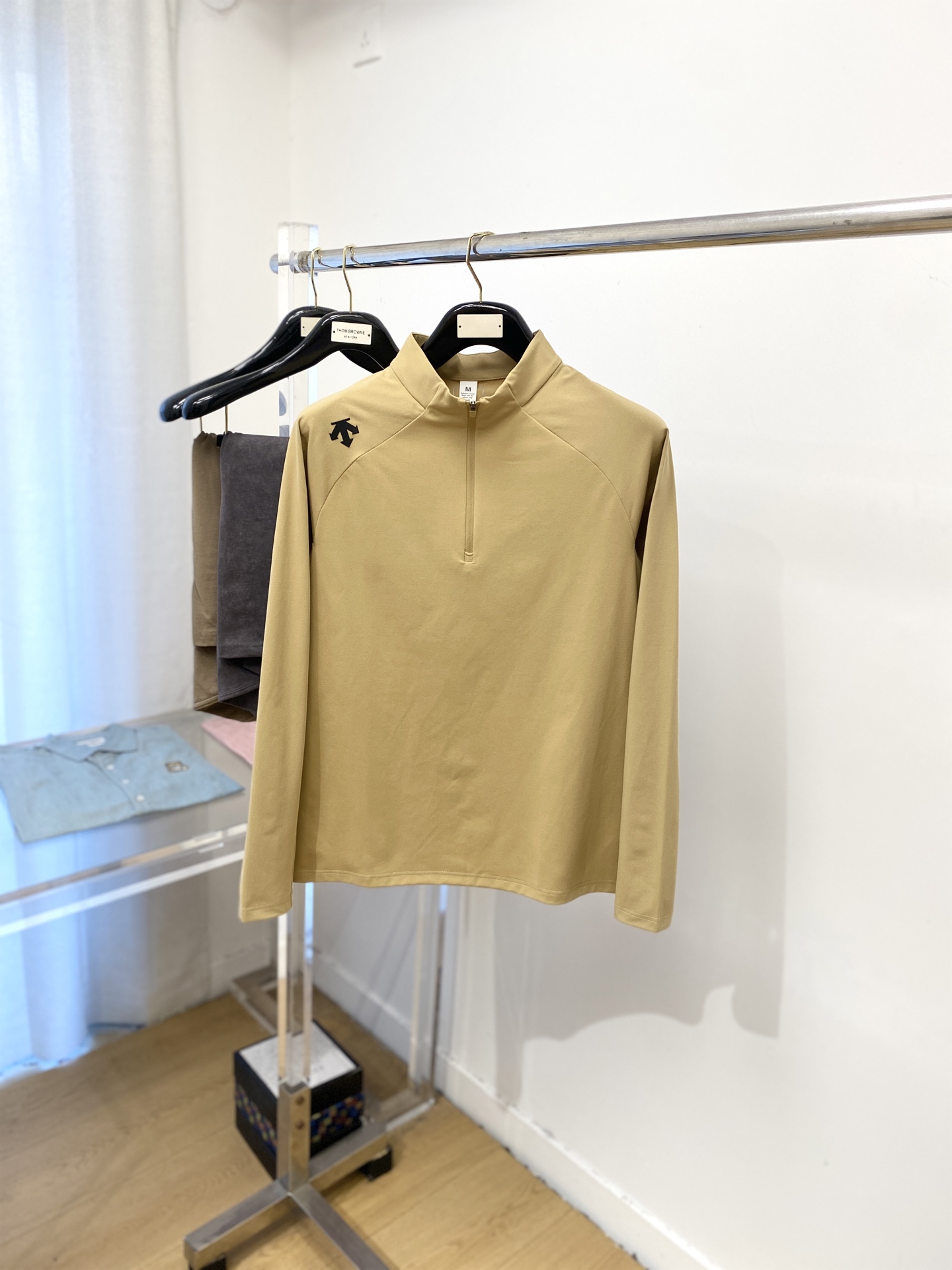 Title: DESCENTE DiSant 2025 Long Sleeve Shirt Review Summary: New stylish long sleeve shirt with shoulder logo, $100, cotton fabric, cozy, maintains shape, available in sizes