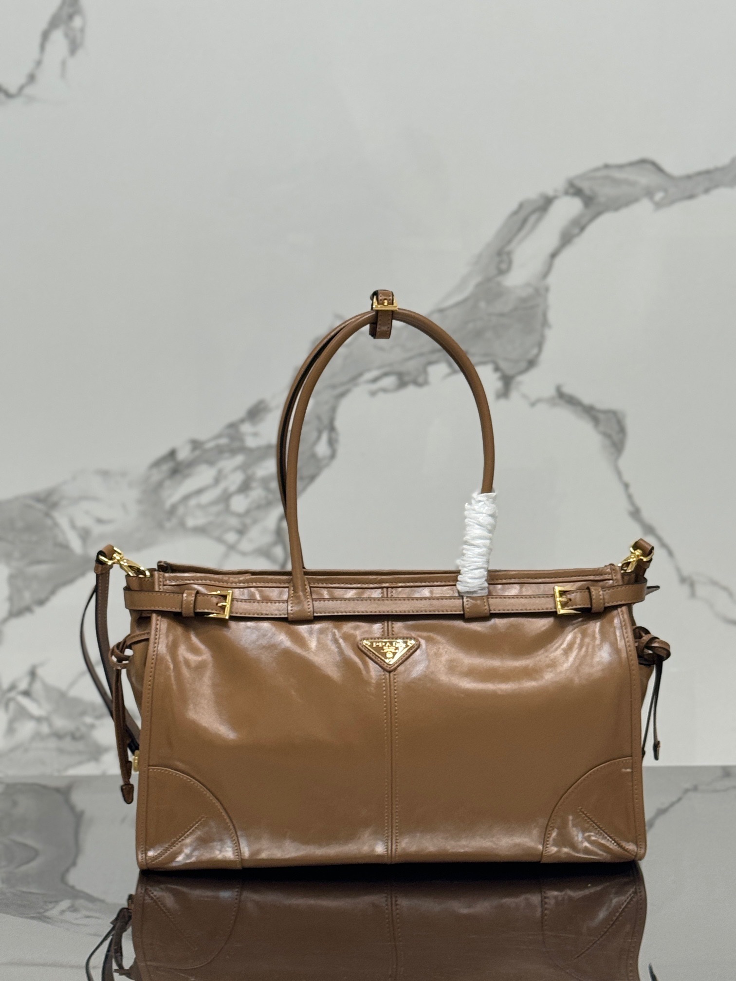P family  Medium Tote Bag 1BA433 This Luxsoft handbag is made of imported top layer oil wax cowhide, with logo lining and top-grade hardware. It comes with a detachable adjustable long shoulder strap, an interior zipper pocket, and a very spacious capacity. It is super lightweight and versatile. Dimensions: 38 x 30 x 12 0071080 image 1