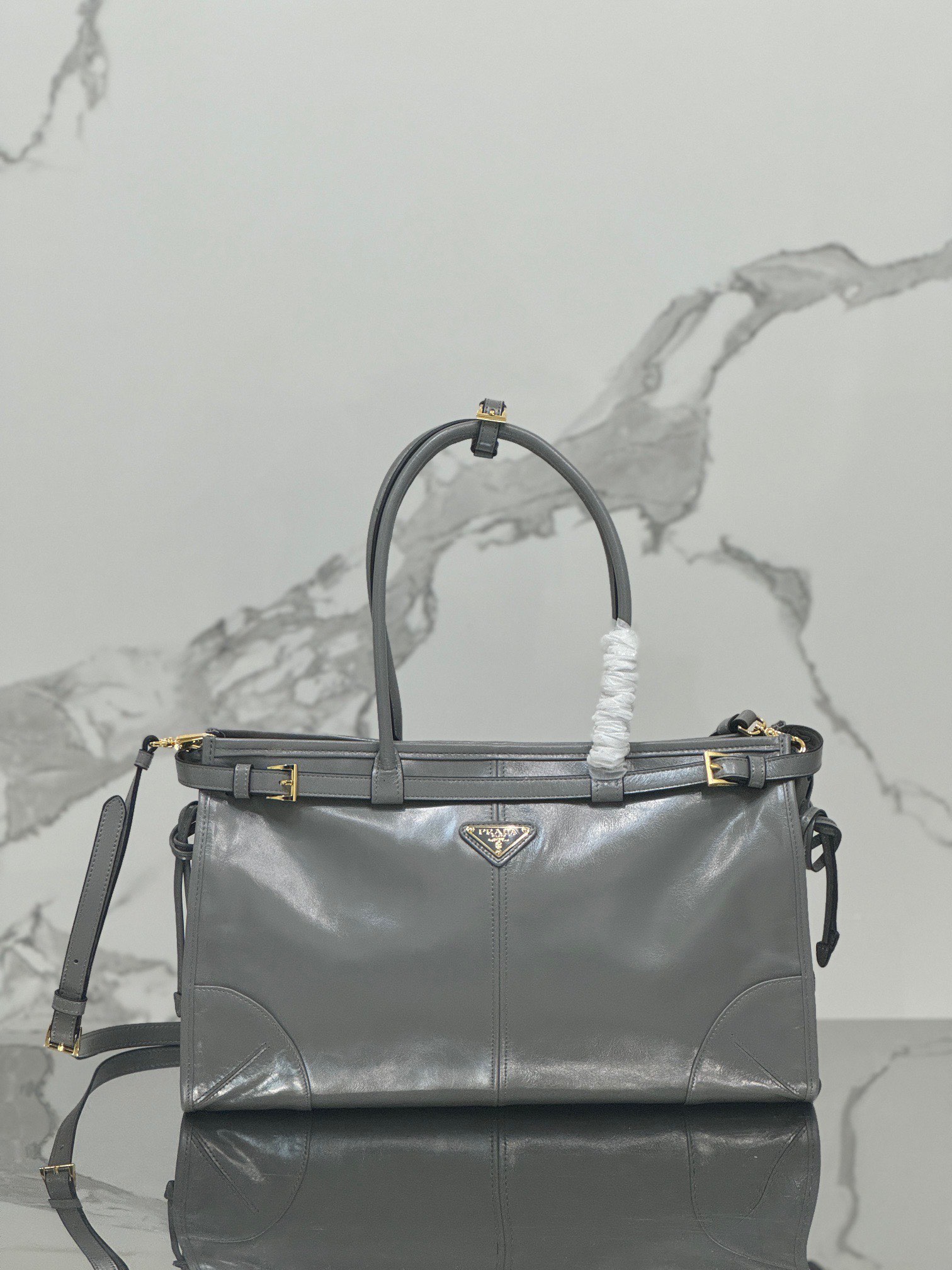 P family  Medium Tote Bag 1BA433 This Luxsoft handbag is made of imported top layer oil wax cowhide, with logo lining and top-grade hardware. It comes with a detachable adjustable long shoulder strap, an interior zipper pocket, and a very spacious capacity. It is super lightweight and versatile. Dimensions: 38 x 30 x 12 0071080 image 1