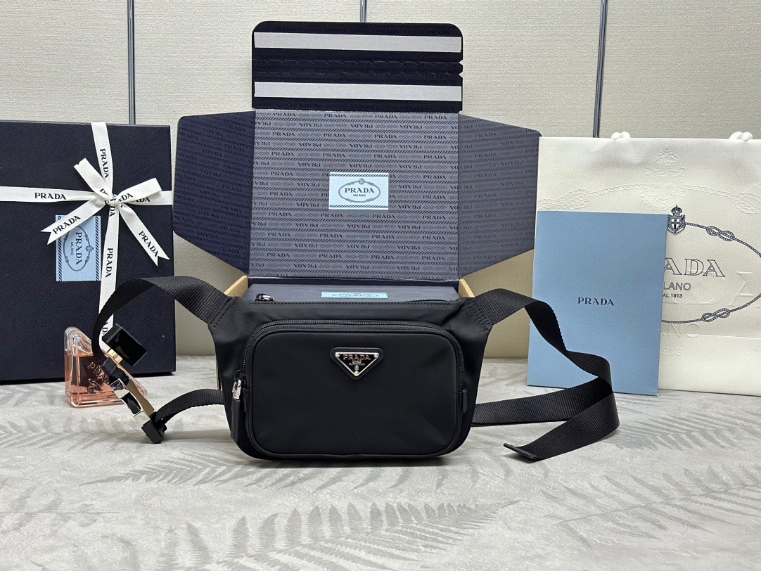 P family  Chest Bag 2VH128. This chest/waist bag is made of imported waterproof fabric, top-quality hardware, and adjustable nylon shoulder strap. It features two zippered compartments for storing phone/passport, ultra-lightweight, and offers a stylish and minimalist look when worn. Dimensions: 19 x 13 x 2.5. Item code: 007380. image 1