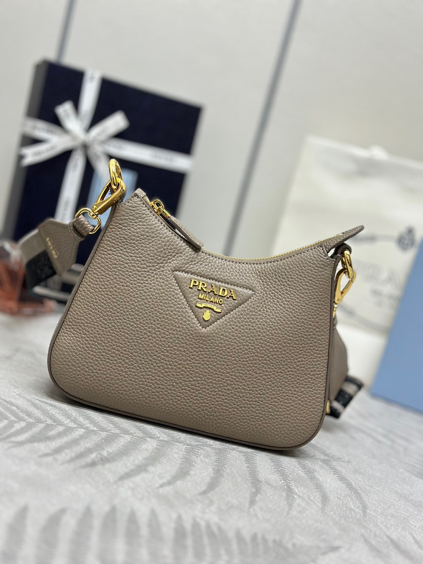 P Brand Deer Skin Single Shoulder Bag 1BH193 Small Size. This single shoulder strap bag is made of imported deer skin patterned cowhide, lined with sheepskin, and features top-grade hardware. It comes with a detachable adjustable fabric long shoulder strap, one patch pocket and a zippered pocket inside, suitable for both single shoulder and crossbody wear. Dimensions: 24 x 18 x 6. Item number: 007980. image 1