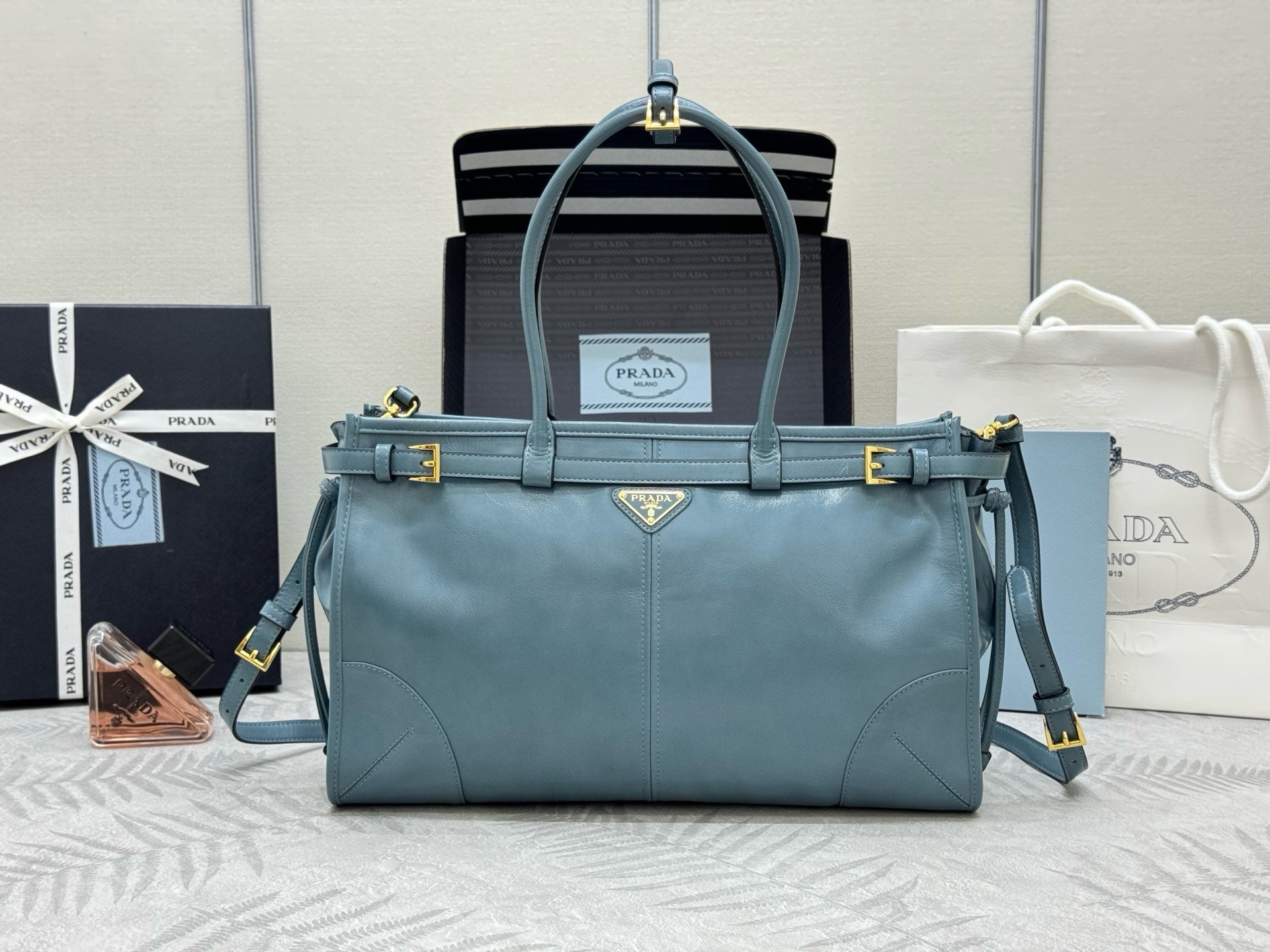 P Brand Medium Tote Bag 1BA433. This Luxsoft handbag features imported first-layer waxed cowhide, logo lining, and premium hardware. Comes with a detachable adjustable long shoulder strap, one interior zip pocket, very spacious, lightweight, and versatile. Dimensions: 38 x 24 x 12 cm. 0071080 image 1