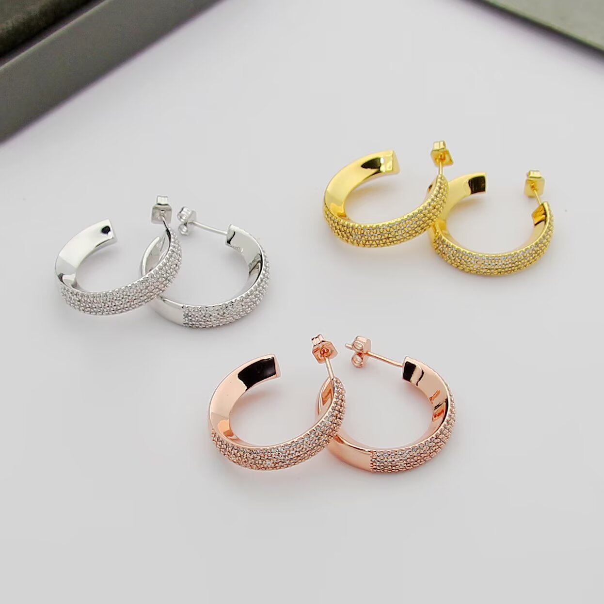 Messika Move Series Pave Hoop Earrings earrings Available in rhodium-plated silver-toned metal yellow gold-toned metal and rose gold-toned metal all set with clear pave diamonds 20mm outer hoop diameter