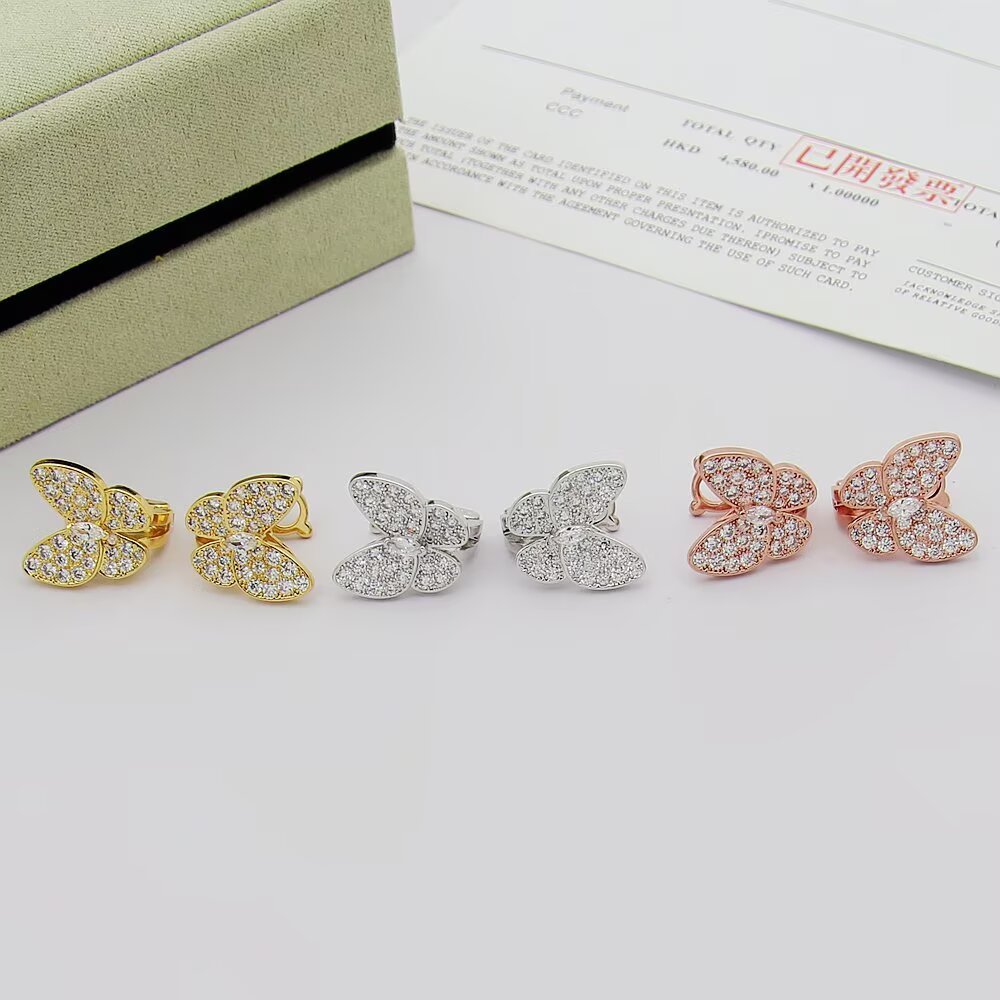 Van Cleef Arpels Boucles d'oreilles Two Butterfly Or jaune 18 carats avec diamants clairs Or blanc 18 carats avec diamants clairs Or rose 18 carats avec diamants clairs Taille unique