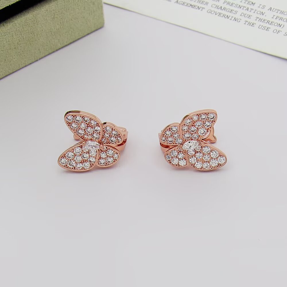 Van Cleef Arpels Boucles d'oreilles Two Butterfly Or jaune 18 carats avec diamants clairs Or blanc 18 carats avec diamants clairs Or rose 18 carats avec diamants clairs Taille unique
