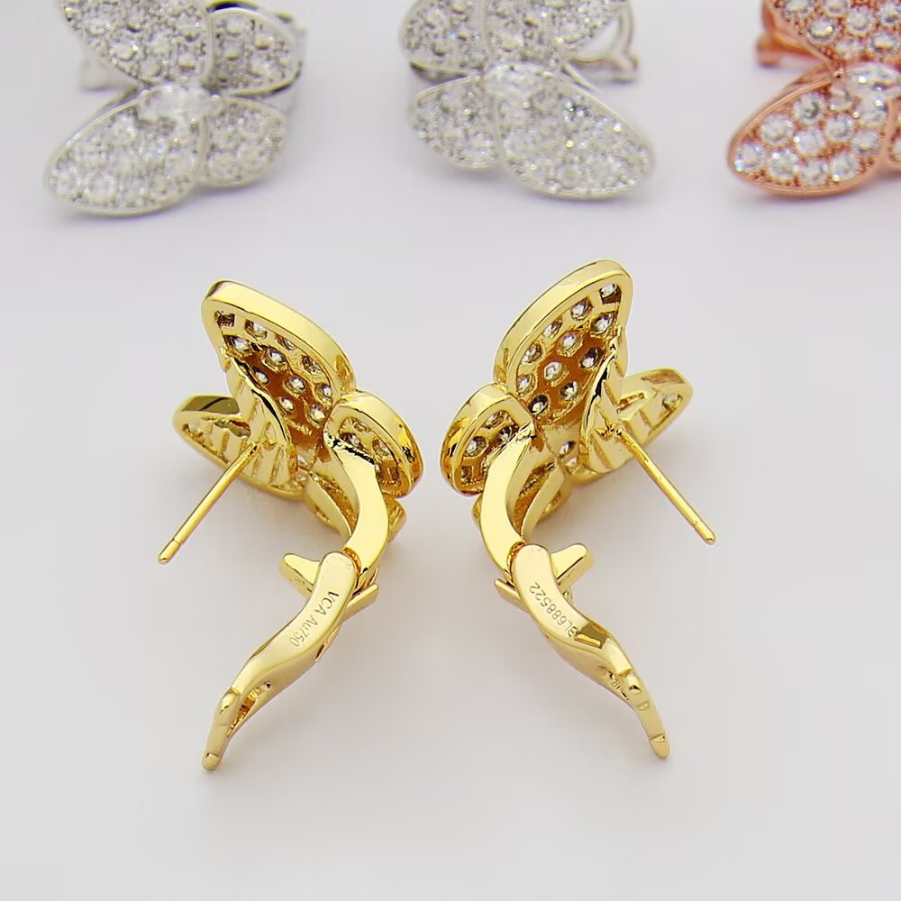 Van Cleef Arpels Boucles d'oreilles Two Butterfly Or jaune 18 carats avec diamants clairs Or blanc 18 carats avec diamants clairs Or rose 18 carats avec diamants clairs Taille unique