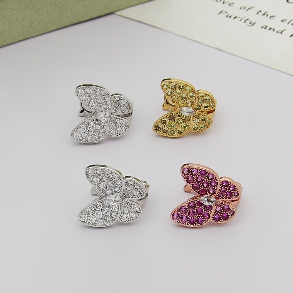 Van Cleef Arpels Boucles d'oreilles Two Butterfly Or blanc avec diamants incolores or jaune avec saphirs jaunes et diamants incolores or rose avec saphirs roses et diamants incolores largeur papillon 12 mm