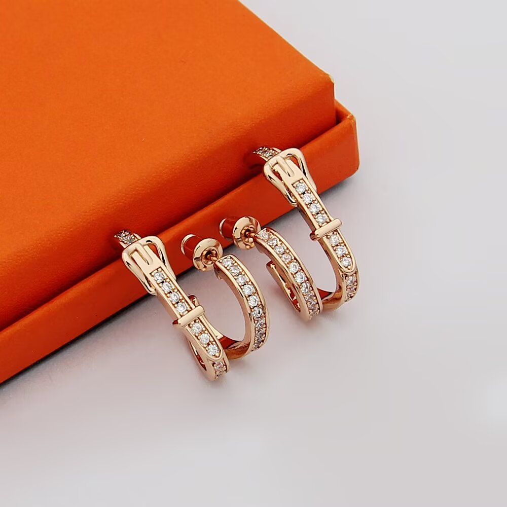 Hermes Belt Buckle Double Hoop Earrings earrings Silver-toned metal with clear pave diamonds also available in yellow gold-toned metal with clear pave diamonds rose gold-toned metal with clear pave diamonds 1 5cm outer hoop diameter