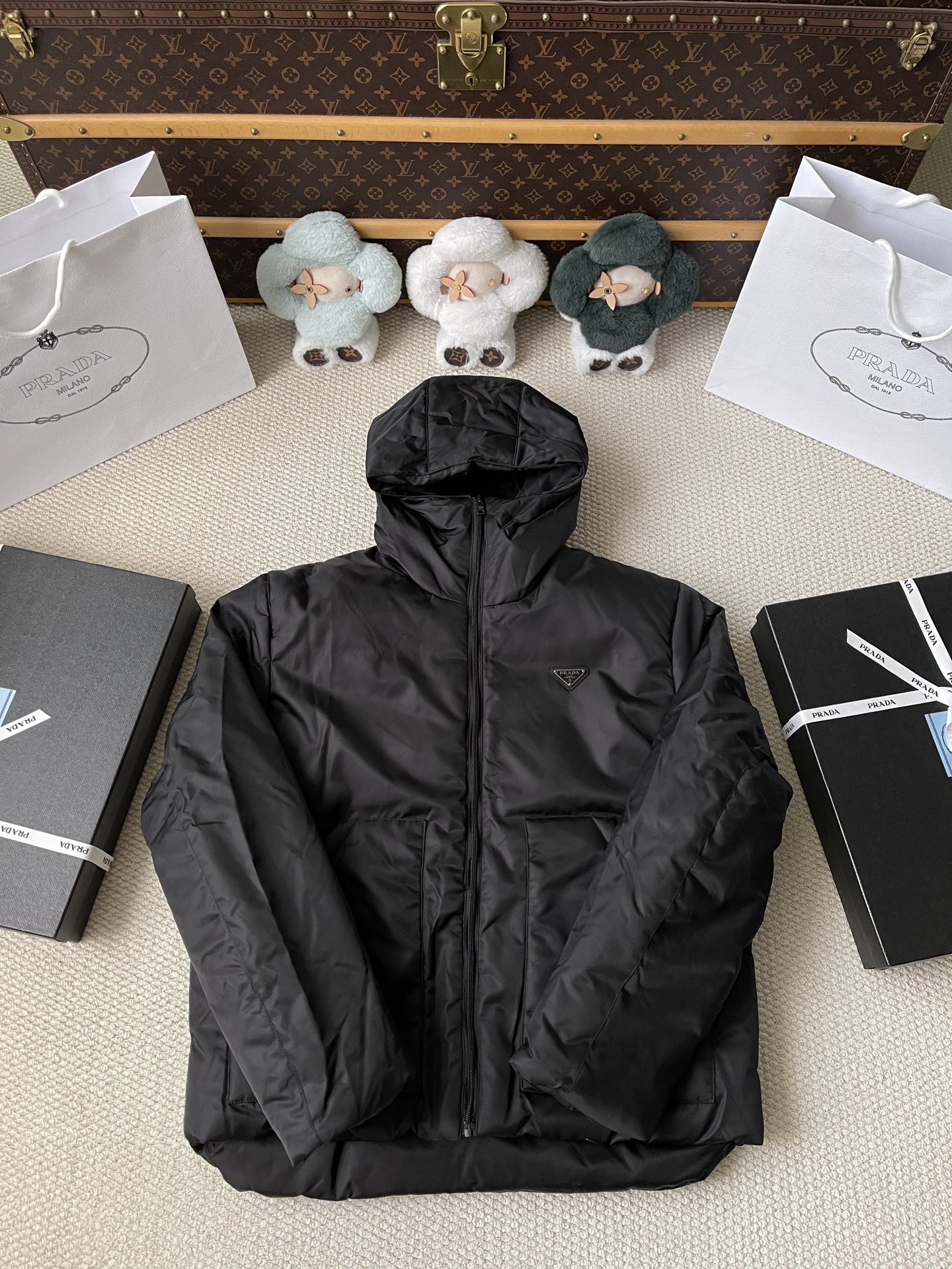 Triangle-Badge Hooded Quilted Jacket — product photograph