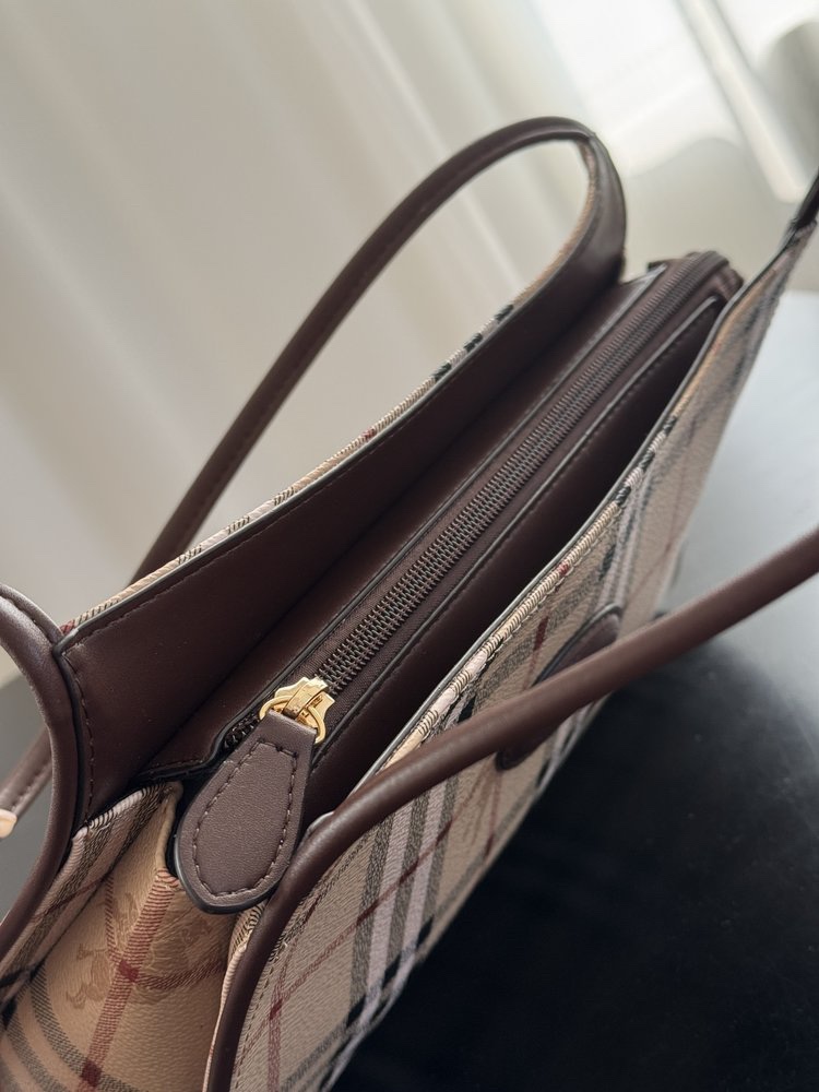 Sized to hold daily essentials including a smartphone, cardholder, and - Comprehensive