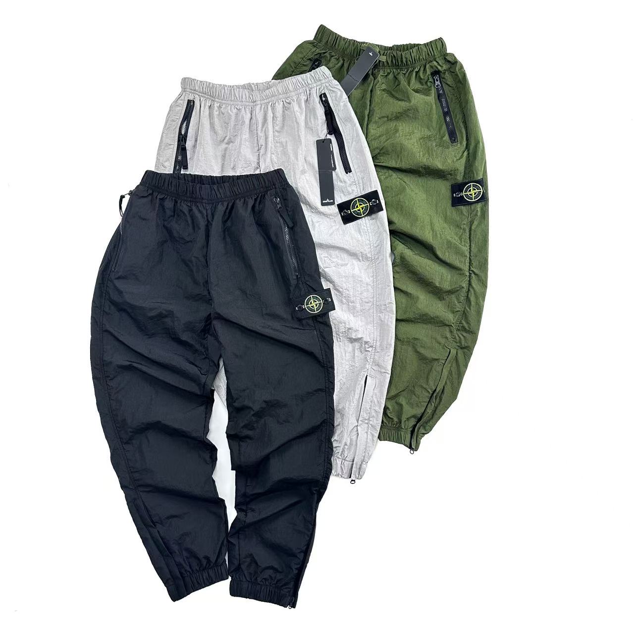 Stone Island Metal Nylon Jacket: Classic Badge, Bold Design, Water Repellent, Various Sizes.