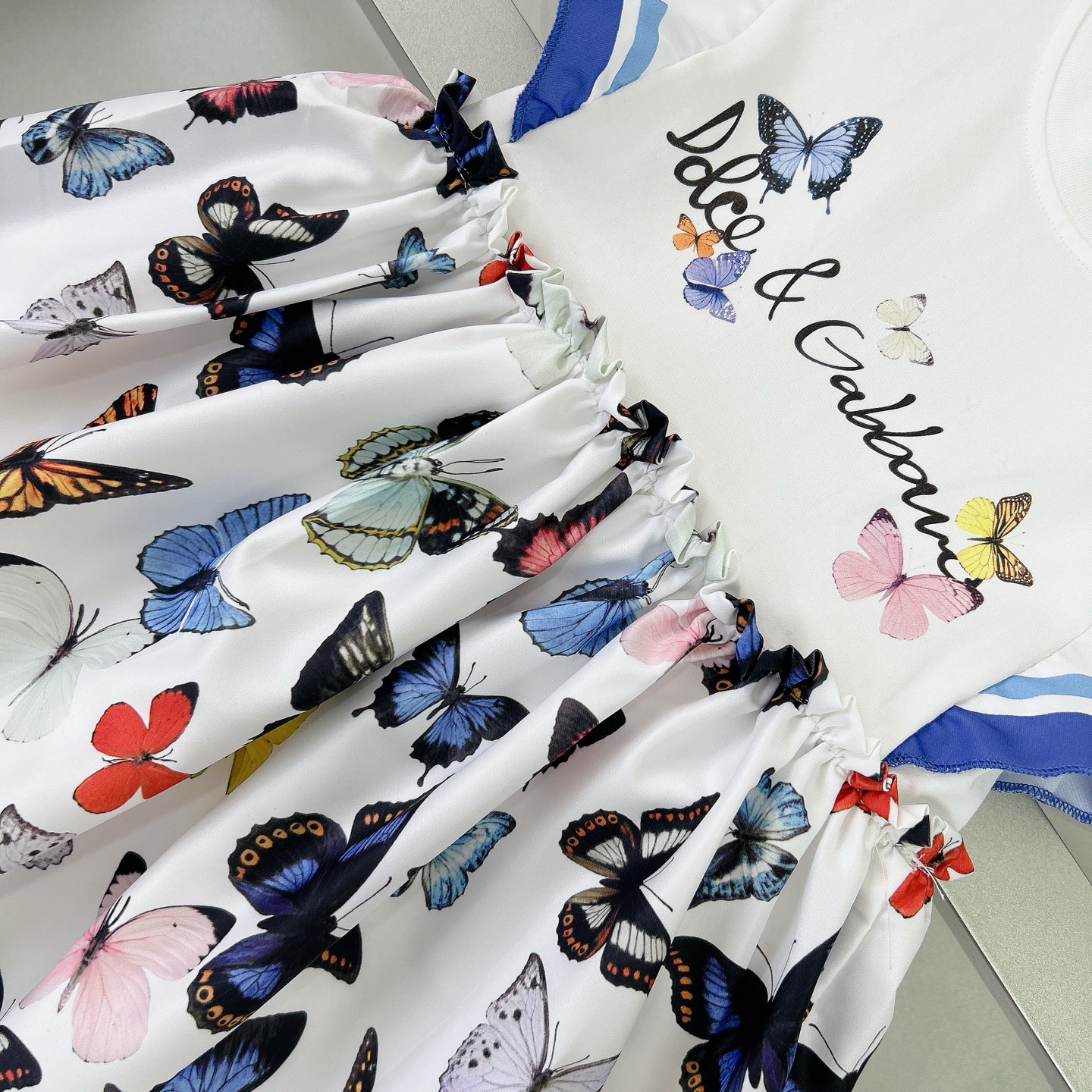 “Dolce & Gabbana Girl’s Dress: Elegant Flower Butterflies, Silk-Coated Fabric, $350” - 图片 5