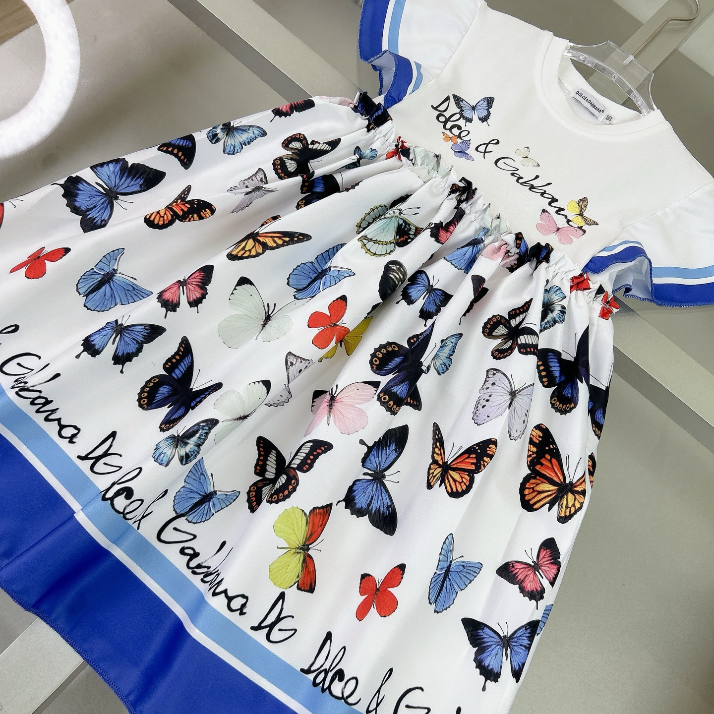 “Dolce & Gabbana Girl’s Dress: Elegant Flower Butterflies, Silk-Coated Fabric, $350” - 图片 3