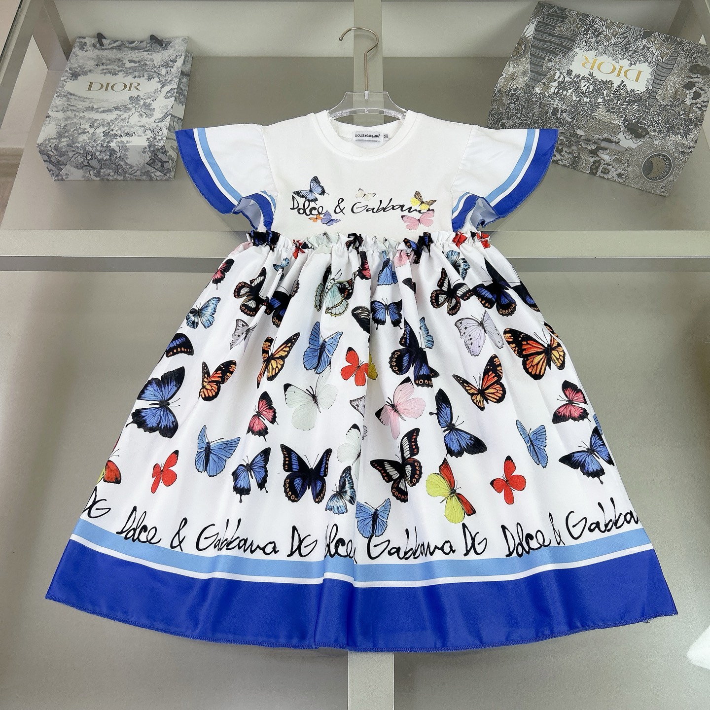 “Dolce & Gabbana Girl’s Dress: Elegant Flower Butterflies, Silk-Coated Fabric, $350”