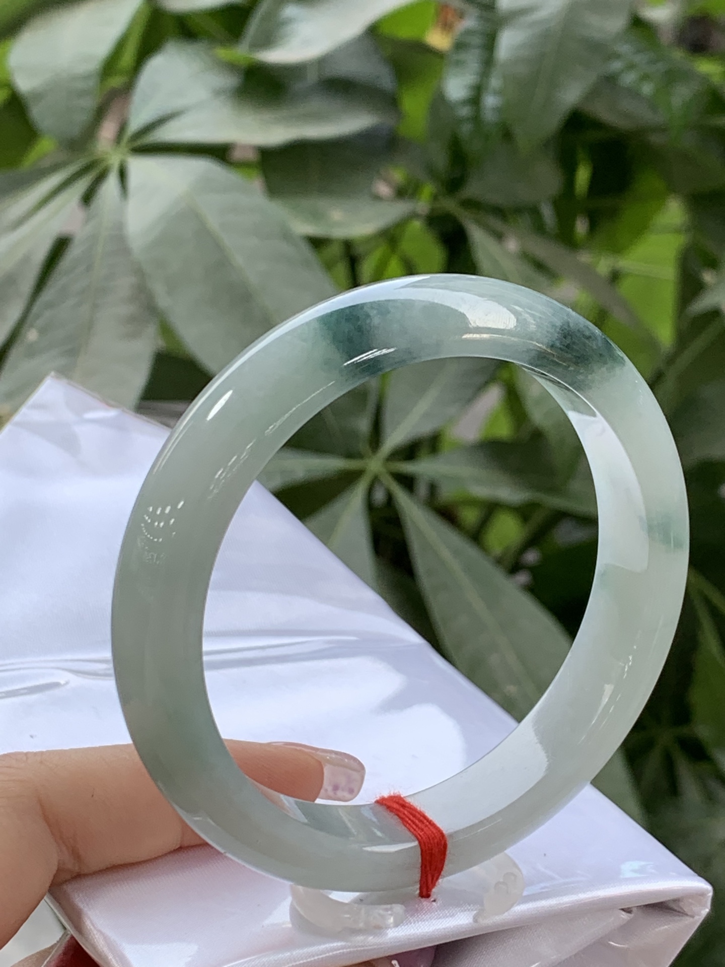 Clear base with floating green flowers, Peace bangle 3