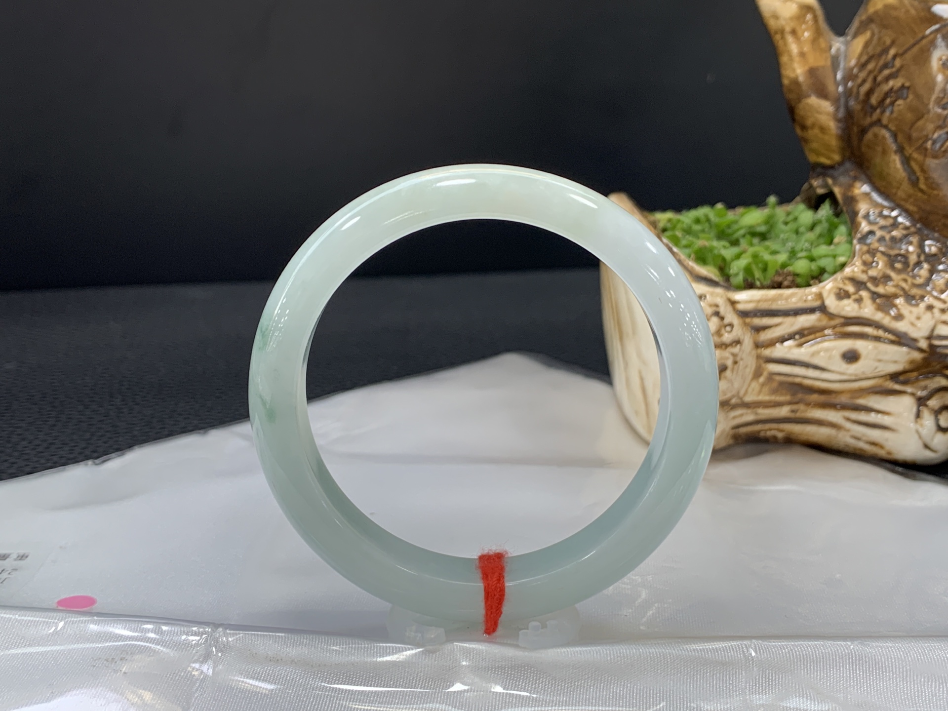 Round bracelet, clear base with floating floral patterns, small inner diameter