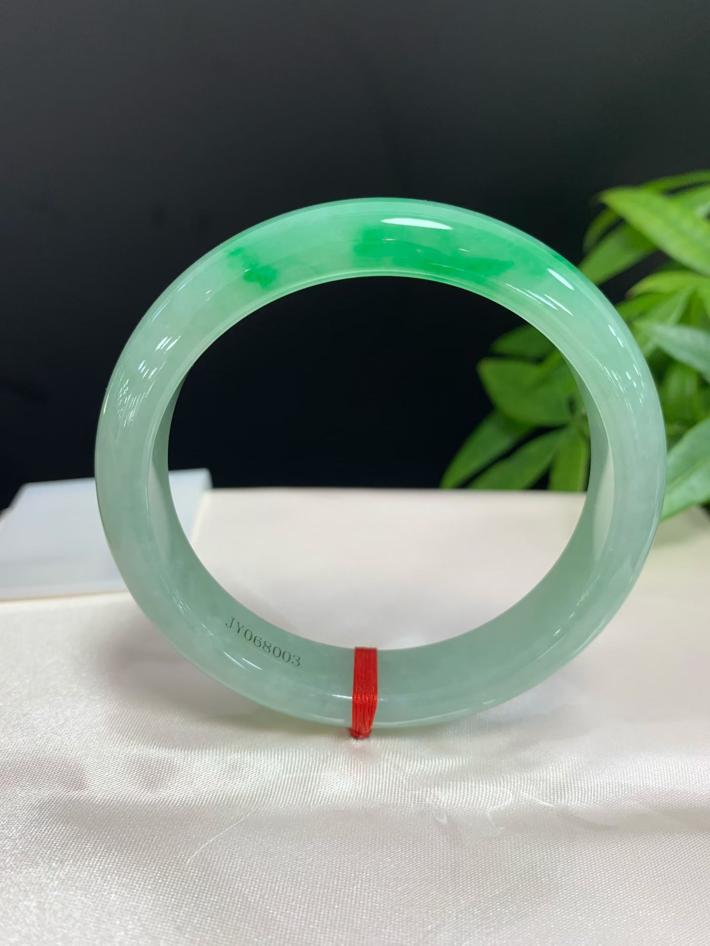 Clear base with green floating safety bangle