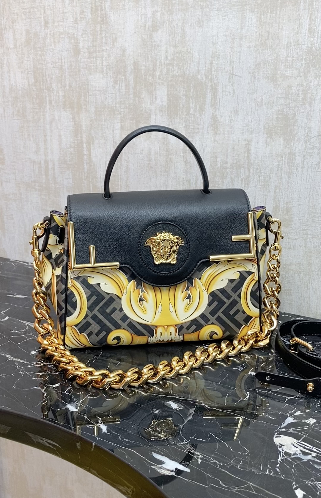 Fendi The most popular joint brand of the century, the versatile handbag can be carried by hand or worn cross-body using the interchangeable chai