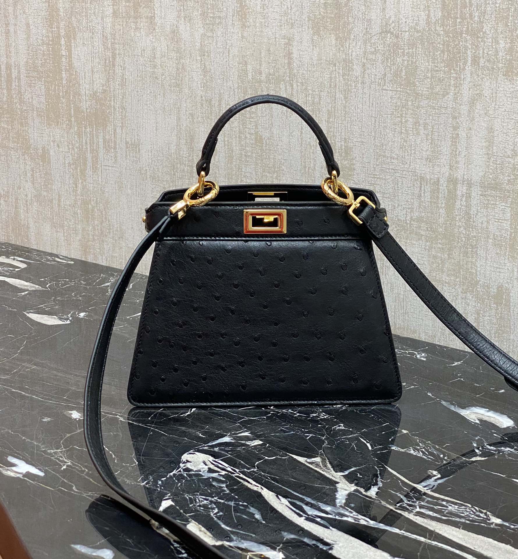 Fendi The ultimate detail: black gold buckle