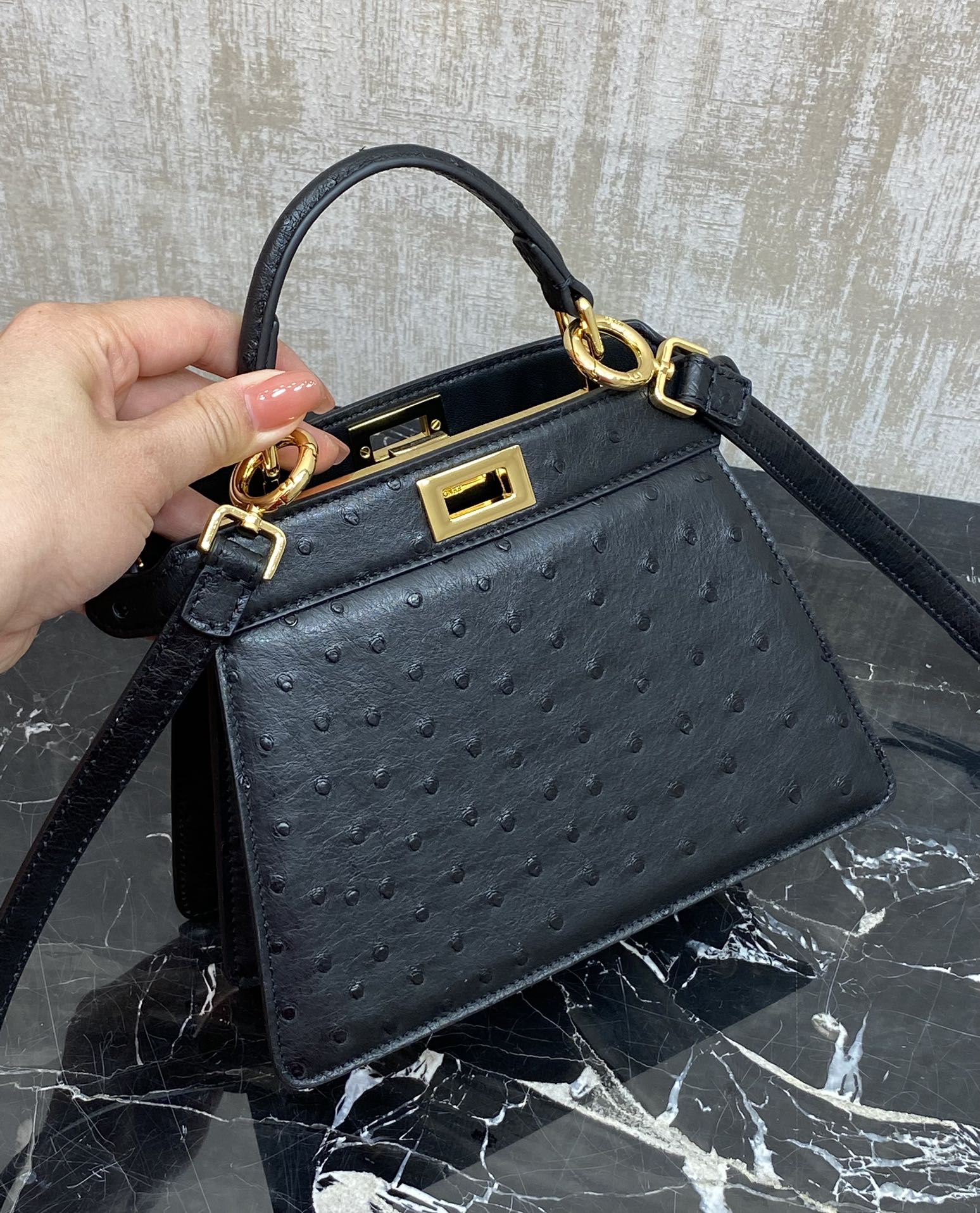 Fendi The ultimate detail: black gold buckle