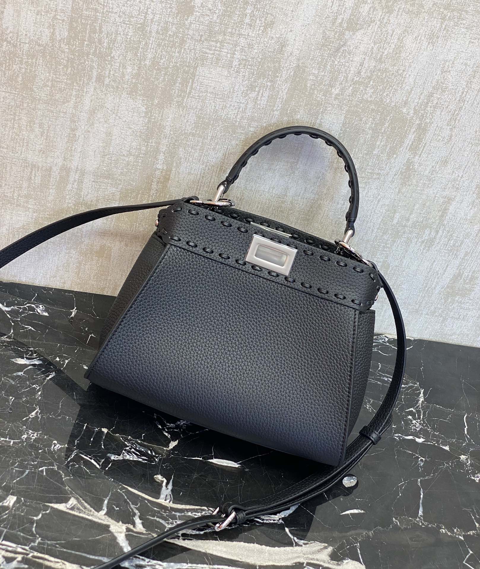 Fendi Peekaboo details: Black, Peekaboo, is a color that is suitable for all seasons, and will never go out of style. It has pebbled Roman calfsk