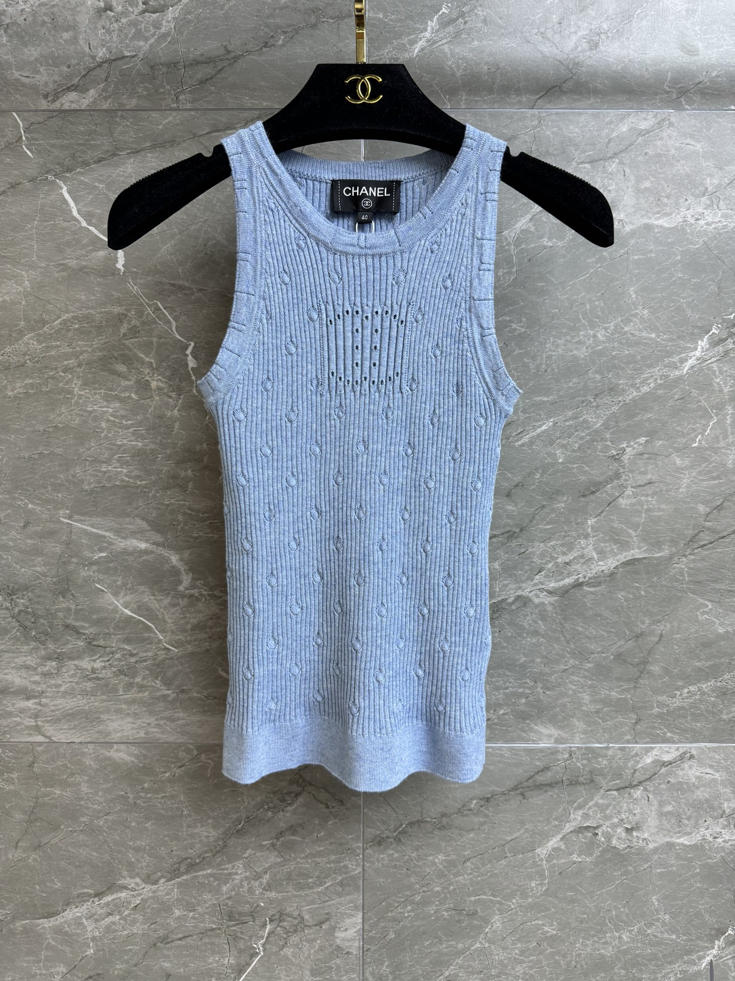 NO:321004,New spring and summer models are shipped. Xiangjia hollow double C polka dot vest. 2025 early spring preview series. Round neckline design. Three-dimensional polka dot combined with double C hollow pattern. Blue color is fresh and elegant. Cotton knitted fabric. Comfortable and skin-friendly. Elastic slim fit. Upper body looks slim and temperament. Full trademark size SML, chanel, alexander wang.19860909春夏新款出货啦 香家镂空双C波点背心 2025早春预告系列 圆领领口设计 立体波点结合双C镂空图案 蓝色配色清新淡雅 棉质针织面料 舒适亲肤 弹力修身版型 上身显瘦又气质 商标齐全 尺码SML,,chanel,alexander wang,Women's clothing