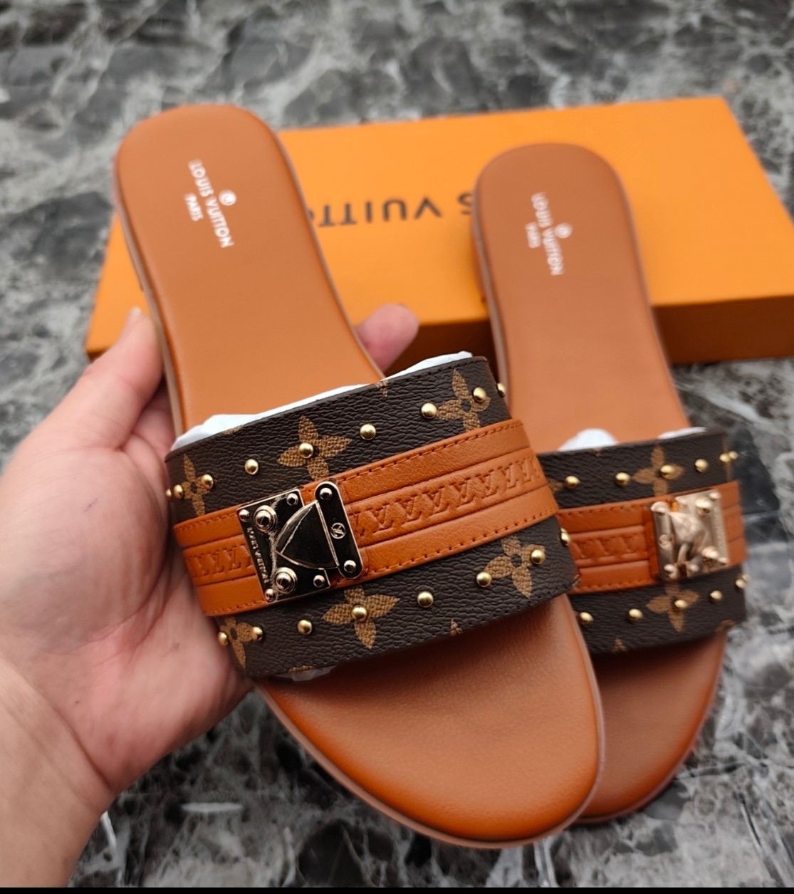 Louis Vuitton Lock It Flat Mule Sandal in Monogram Canvas - Luxury Slide 1 Louis Vuitton Lock It Flat Mule Sandal in Monogram Canvas - Luxury Slide