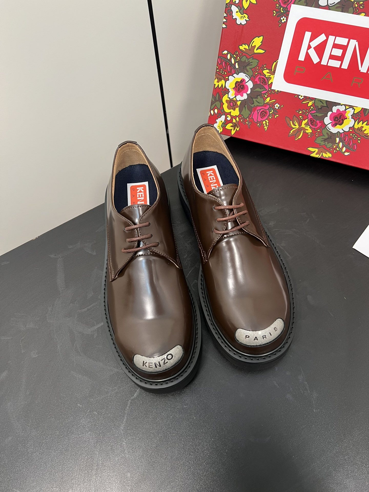 Kenzo Steel Head Shoe: Elegant Leather with Military Inspiration, Circular Toes, Metal Panel.