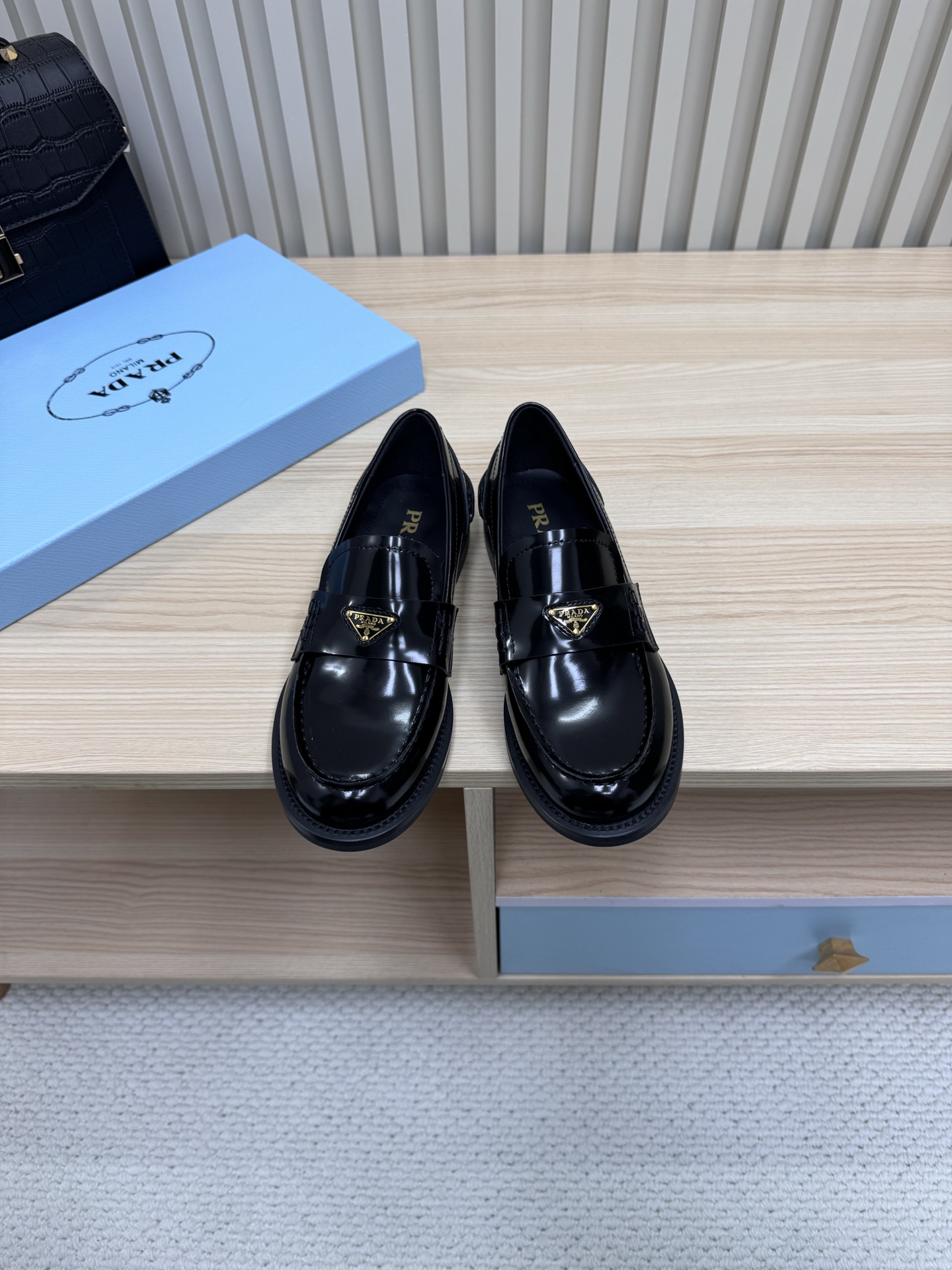 NO:237727,Prada couple loafers | Intertwined fashion and quality. This couple loafers are a treasure item. The upper is selected as a high-quality mercerated beef reverse velvet leather, with a delicate touch, and the suede has a high-end texture, which shows low-key luxury under the light. The inner part is silk sheepskin, which is soft in the skin, and every step seems to be stepping on the clouds. The classic triangle mark is eye-catchingly embellished with the buckle, demonstrating the brand identity, and is undoubtedly the 