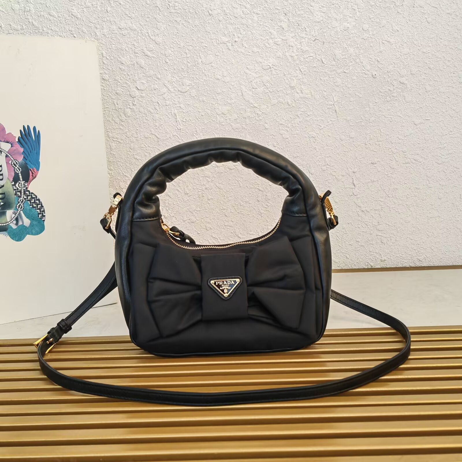 Prada Re-Nylon and Nappa Leather Mini Hobo Bag with Oversized Bow 2 a1745212569868 6787