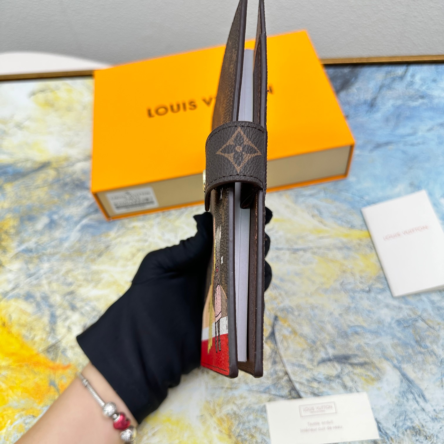 Leather notebook in hand