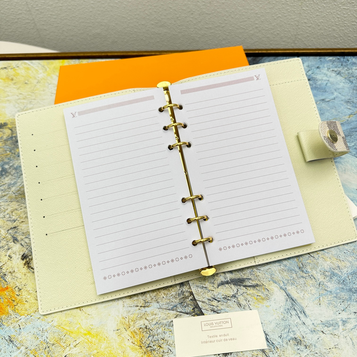 Leather notebook being used to take notes
